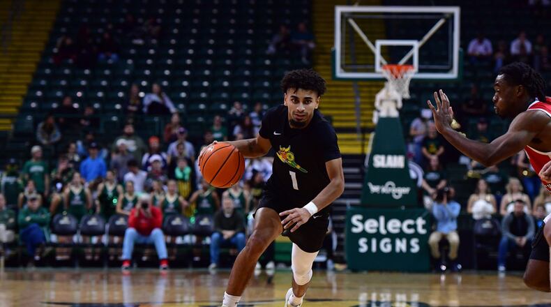 Wright State's Trey Calvin drives against a Western Kentucky defender during a game earlier this season. Calvin scored 27 points Sunday in the Raiders' road win at IUPUI. Wright State Athletics photo