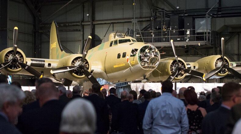 Crowds gather around the B-17F Memphis Belle to get a better look at the conclusion of its unveiling ceremony at the Memphis Belle exhibit inside the National Museum of the U.S. Air Force, Wright-Patterson Air Force Base, May 16. The Memphis Belle is the most famous Flying Fortress, having been the first able to return to the United States following 25 combat missions over occupied Europe during World War II. (U.S. Air Force photo/Wesley Farnsworth)