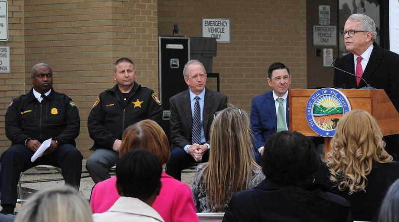 Ohio Governor Mike DeWine talks about the importance of the new Montgomery County Crisis Receiving Center during a ribbon cutting ceremony Monday, April 24, 2023. from left, Dayton Police Asst. Police Chief Eric Henderson, Montgomery County Sheriff Rob Streck, RI International President & CEO David Covington and RI Internatainal State Director, Vincent Sabino. MARSHALL GORBY\STAFF