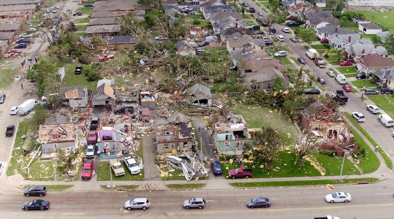Houses in the Old North Dayton neighborhood along Troy Street where a tornado ripped through industrial buildings across the street and then the neighborhood on Monday night. TY GREENLEES / STAFF