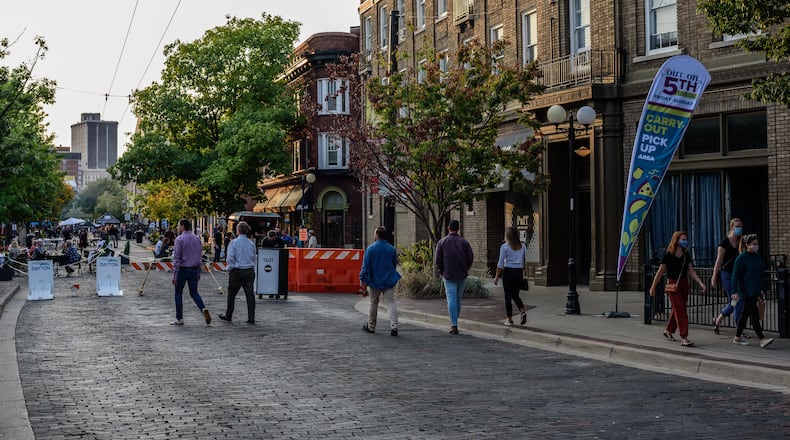 Out on 5th in The Oregon District was held from Friday, September 25th through Sunday, September 27th 2020. 5th Street will be closed to vehicle traffic on the weekends until the end of October to allow for expanded outdoor seating, sidewalk sales and musical entertainment. The goal of Out on 5th is to help Oregon District businesses increase seating capacity outdoors due to limited indoor seating for social distancing requirements during the coronavirus pandemic. Did we spot you there on Saturday, September 26, 2020? TOM GILLIAM/CONTRIBUTING PHOTOGRAPHER