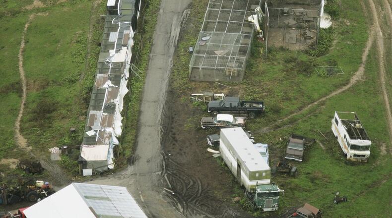 Aerial over the property of Terry W. Thompson two days after he set free his menagerie of exotic pets and then shot and killed himself on October 18, 2011. Among the animals housed on Thompson’s 73-acre spread west of Zanesville were 18 endangered Bengal tigers, 17 lions, and eight bears. In all, 49 animals were destroyed. The incident resulted in an overhaul of Ohio’s exotic animal laws. (Columbus Dispatch photo by Craig Holman, as seen from WBNS 10TV’s Chopper 10)