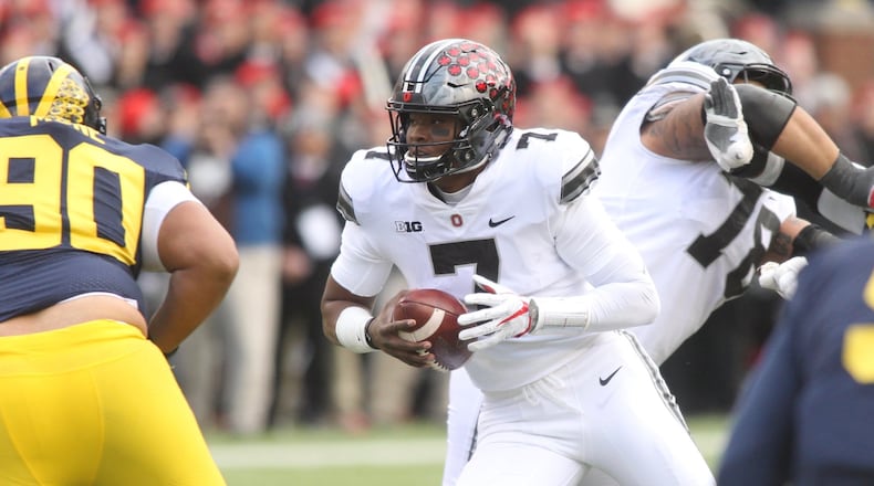 Ohio State’s Dwayne Haskins breaks free for a 22-yard run in the third quarter against Michigan on Saturday, Nov. 25, 2017, at Michigan Stadium in Ann Arbor, Mich. David Jablonski/Staff