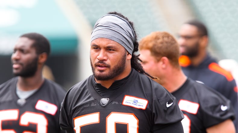 Linebacker Rey Maualuga (58) walks off the field after the first day of Cincinnati Bengals minicamp held at Paul Brown Stadium, Tuesday, June 10, 2014. GREG LYNCH / STAFF
