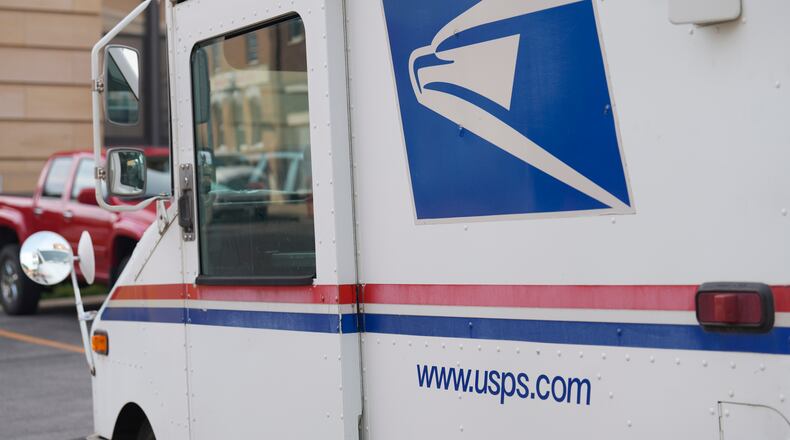 United States Postal Service logo on delivery vehicle outside the post office, Sept. 20, 2023, in Deadwood, S.D. (AP Photo/David Zalubowski)