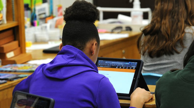 Students at Northwood Elementary in Englewood use educational technology to work on an assignment at their desks. MARSHALL GORBY\STAFF
