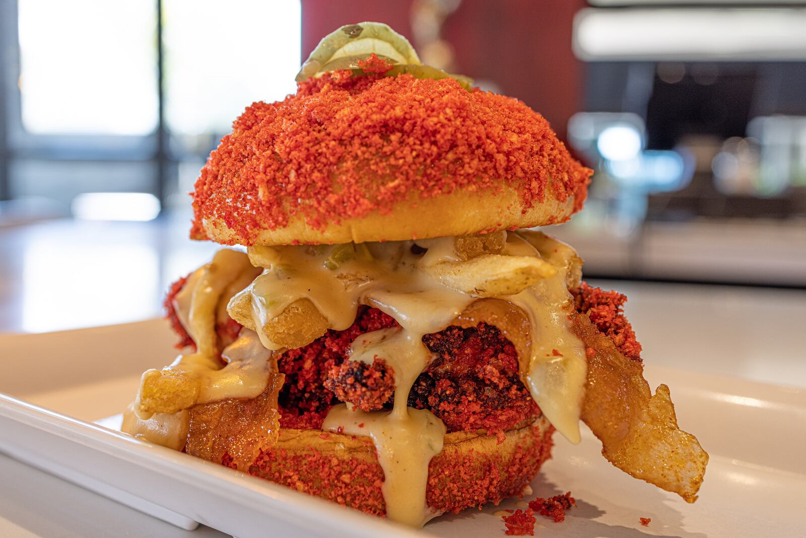 Agave & Rye has released its newest menu featuring several epic food options including the Cheetos Fire Chicken Sammy (CONTRIBUTED PHOTO/ANDREW MATRE).