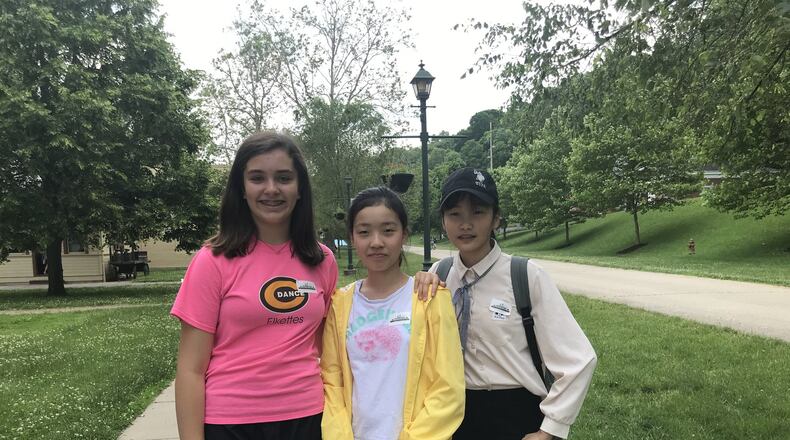 Pictured from left are Sofia Gomez, Huayu Wang and Yanfei Zhang, all middle school students participating in Connect Centerville’s Host Family program with their parents. CONTRIBUTED
