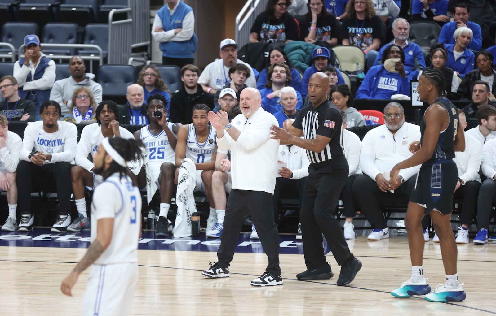 Josh Schertz, of Saint Louis, coaches during a game against George Washington in the quarterfinals of the Atlantic 10 Conference tournament on Friday, March 13, 2026, at PPG Paints Arena in Pittsburgh. David Jablonski/Staff