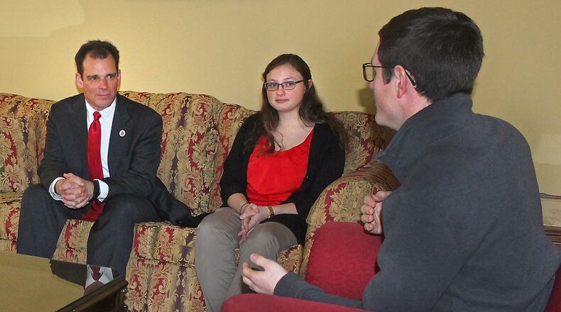 FILE: Wittenberg University President, Michael Frandsen (left) meets with students Meghan Roderick and Casey Luther at the president’s home on campus. JEFF GUERINI/STAFF