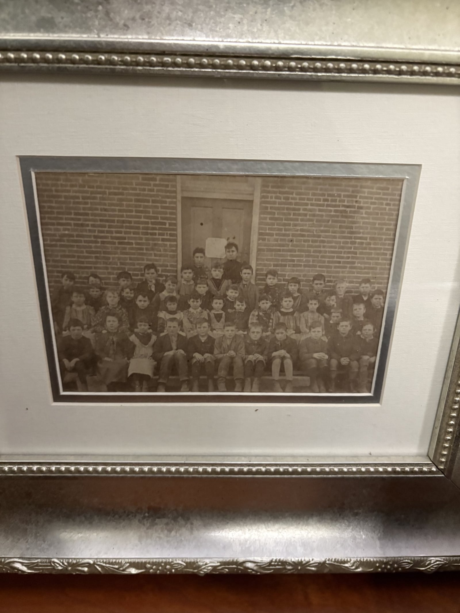A photo of the 1909 class from the old schoolhouse sits in the hallway. Kim Queener has turned an old Brookville schoolhouse into a medieval-themed home. CONTRIBUTED