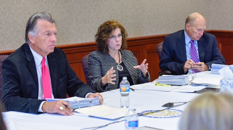 Butler County Commissioners T.C. Rogers, Cindy Carpenter and Donald Dixon sit in budget talks meetings Monday, Oct. 12, 2016, at the Butler County Government Services Center in Hamilton. NICK GRAHAM/STAFF