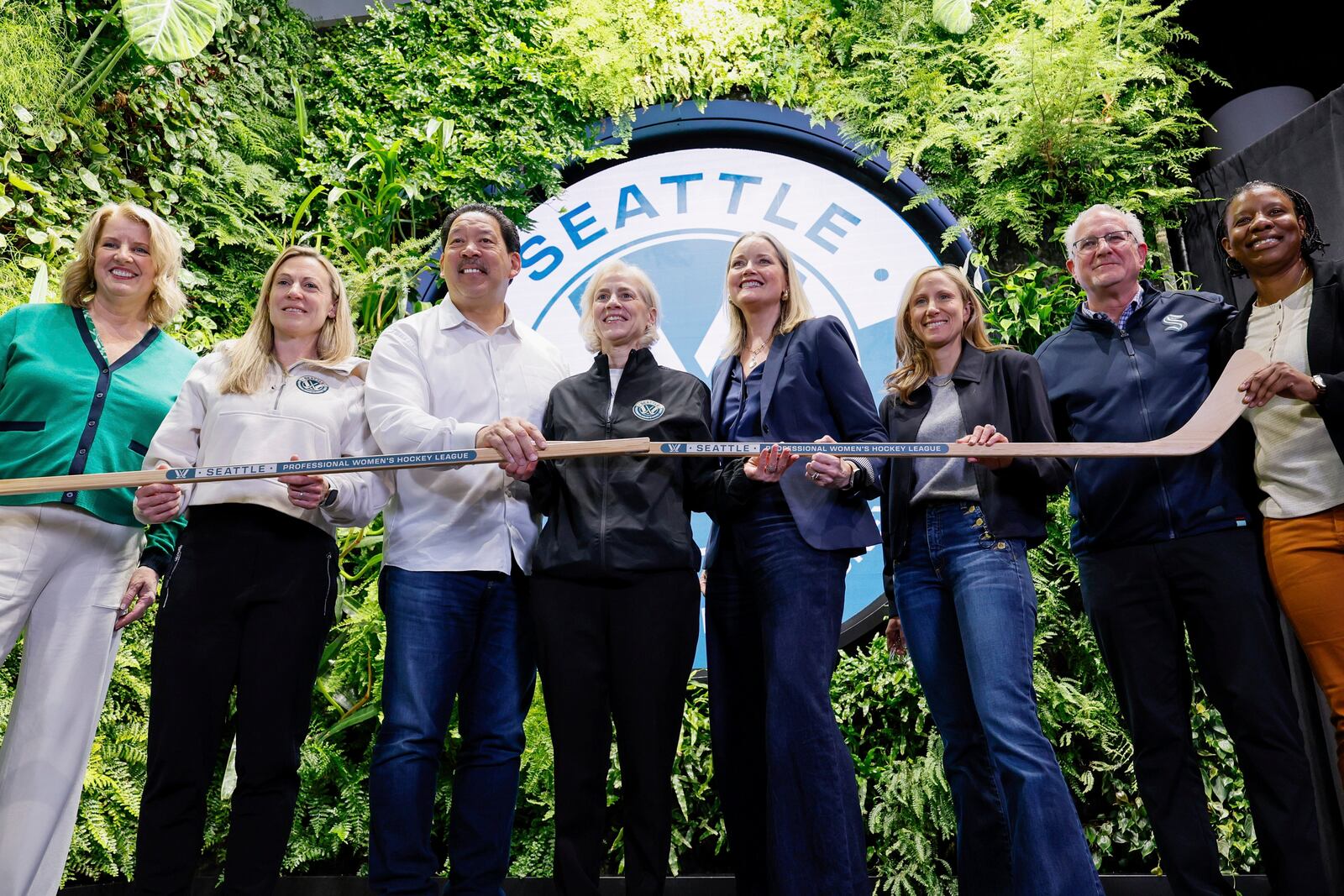 From left, President and CEO of the Seattle Sports Commission Beth Knox, PWHL Executive Vice President of Hockey Operations Jayna Hefford, Seattle Mayor Bruce Harrell, PWHL Executive Vice President of Business Operations Amy Scheer, King County Executive Shannon Braddock, Seattle Kraken co-owner Samantha Holloway, Seattle Kraken CEO Tod Leiweke and Seattle council member Joy Hollingsworth pose for a group photo after a press conference announcing the new PWHL expansion team Wednesday, April 30, 2025, in Seattle. (Jennifer Buchanan/The Seattle Times via AP)