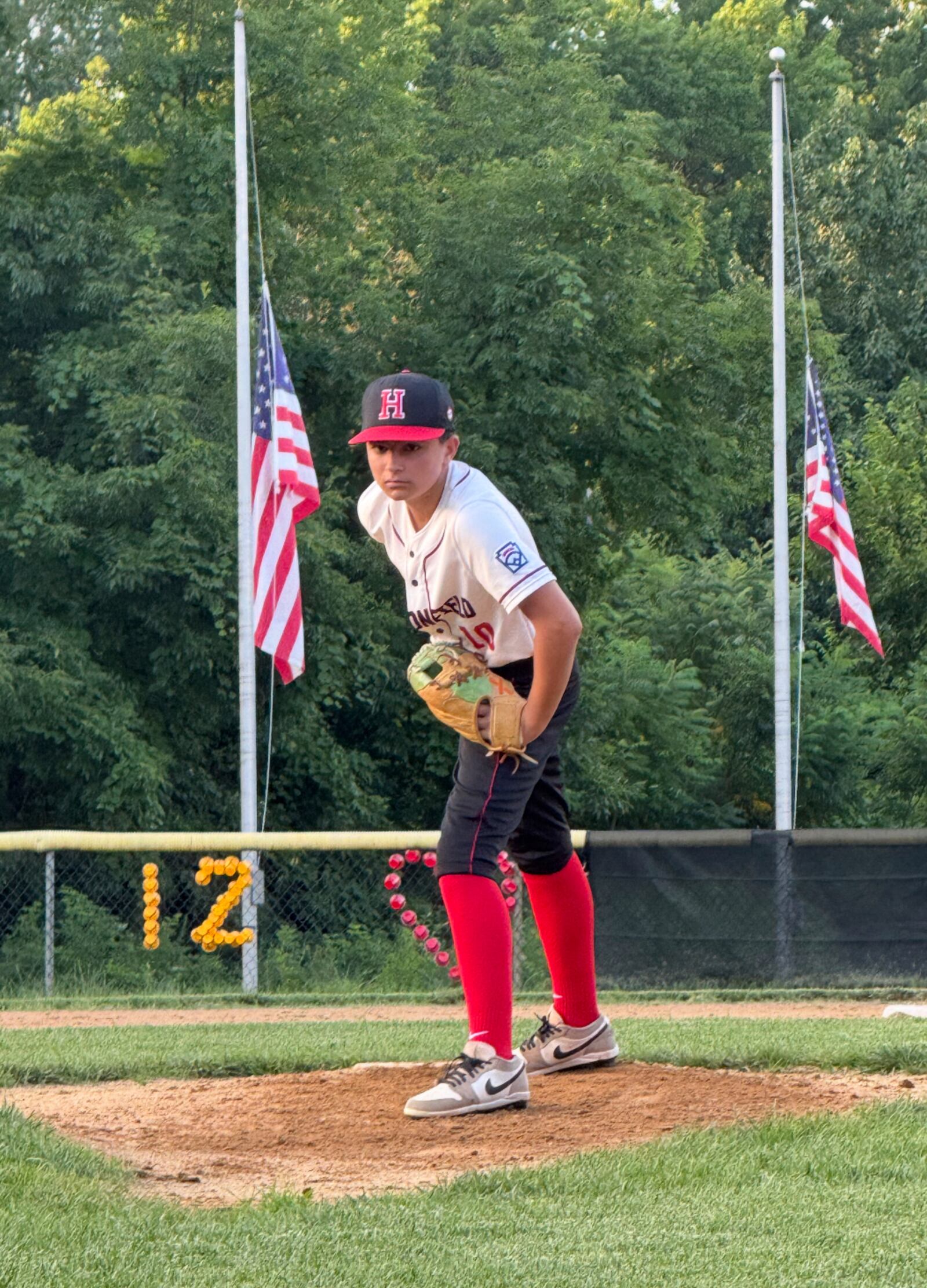 In this undated photo provided by Joseph Rocco, his son Marco Rocco prepares to deliver a pitch in a baseball game in Haddonfield, N.J. (Family courtesy photo via AP)