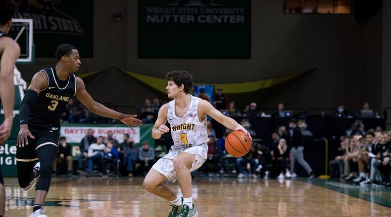 Wright State's Keaton Norris is defended by Oakland's Micah Parrish during a game at the Nutter Center on Feb. 5, 2022. Joseph Craven/Wright State Athletics