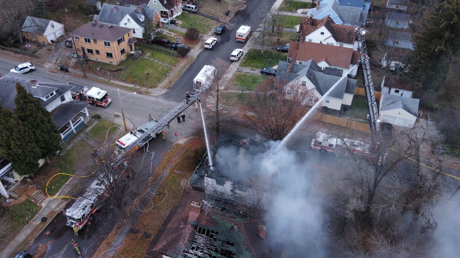 Dayton firefighters responded to a house fire at the intersection of Marathon and Wheatley avenues on Friday, Dec. 10, 2021. JIM NOELKER / STAFF
