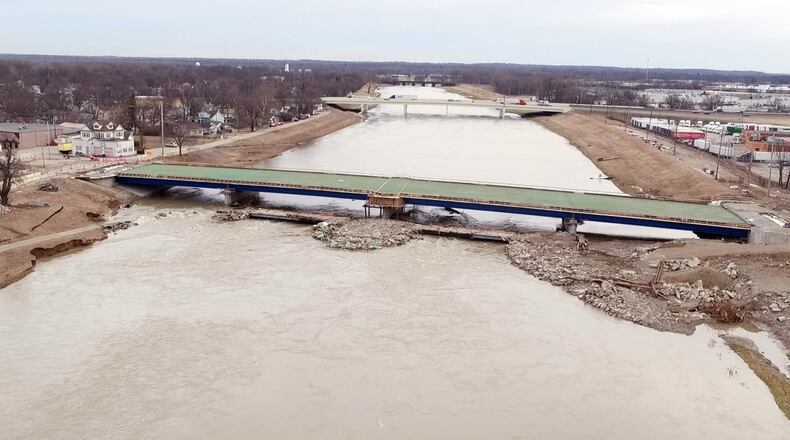 A large water main that runs under the Great Miami River broke, cutting water service to much of Montgomery County. TY GREENLEES / STAFF