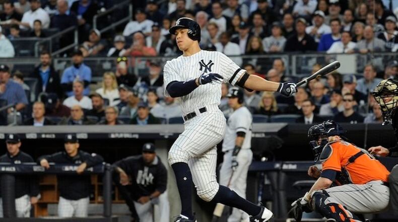 The New York Yankees' Aaron Judge hits an RBI double in the third inning against the Houston Astros in Game 5 of the American League Championship Series at Yankee Stadium in New York on Oct. 18, 2017. (Andrew Savulich/New York Daily News/TNS)