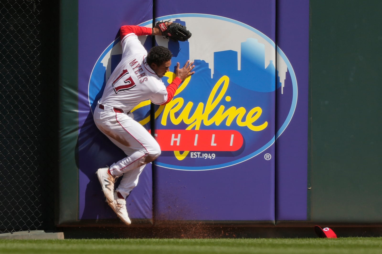 Cincinnati Reds center fielder Dane Myers hits the wall after missing a double hit by Boston Red Sox' Wilyer Abreu during the sixth inning of a baseball game in Cincinnati, Sunday, March 29, 2026. (AP Photo/Carolyn Kaster)
