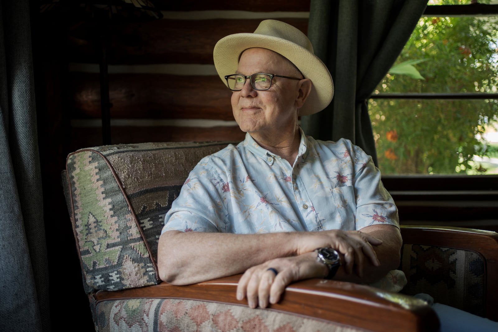Joe Johnston, the founder of Agritopia, a community nestled around a plot of agricultural land, poses for a portrait inside his office April 22, 2025, in Gilbert, Ariz. (AP Photo/Annika Hammerschlag)