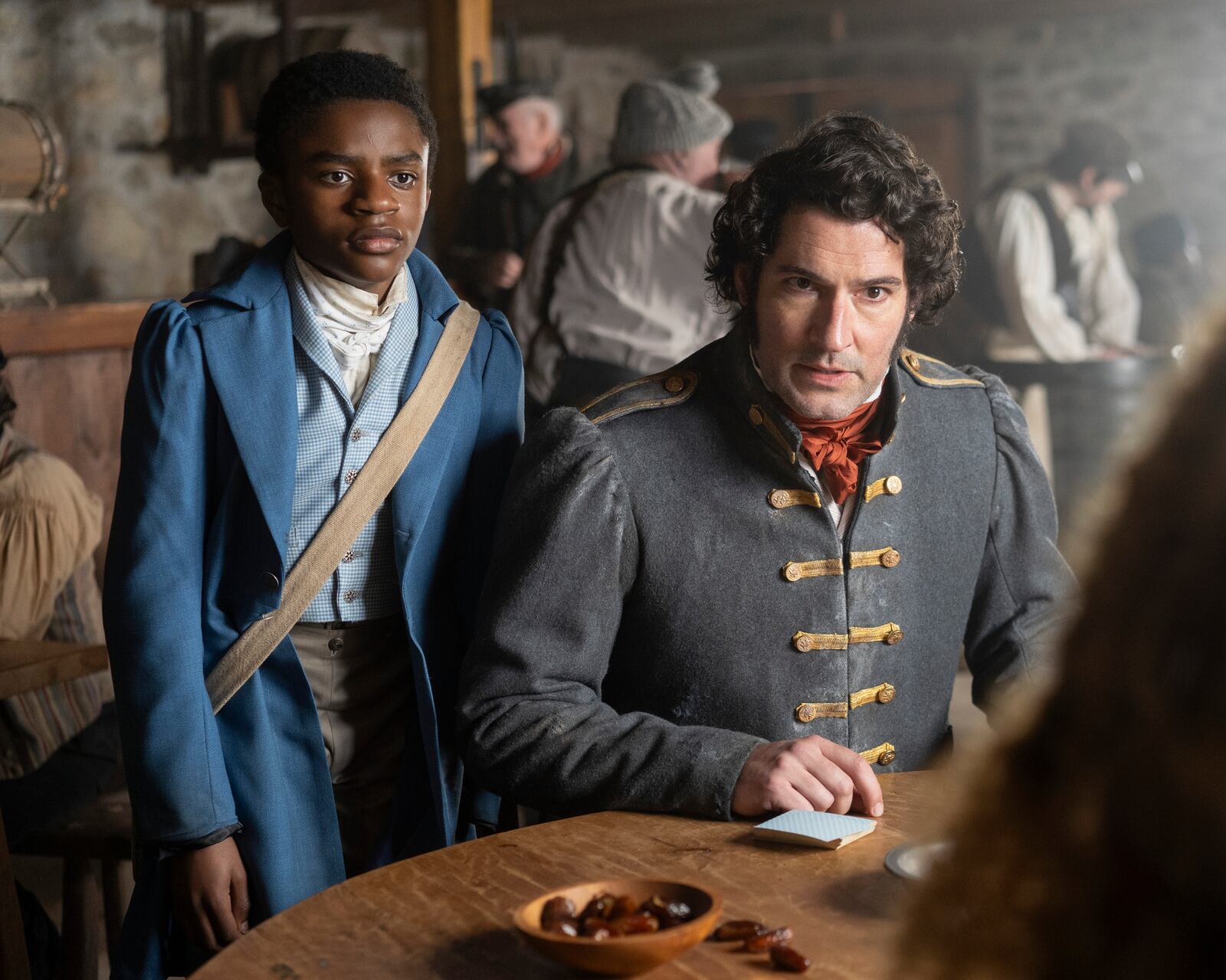 This image released by Disney shows Eddie Karanja, left, and Tom Ellis in a scene from "Washington Black." (Chris Reardon/Disney via AP)