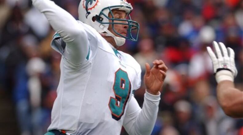 FILE - In this Oct. 17, 2004, file photo, Miami Dolphins quarterback Jay Fiedler passes during the second half against the Buffalo Bills in Orchard Park, N.Y. Dan Marino, perhaps the game's greatest pure passer, left Miami in 1999. In stepped Fiedler who had three pro seasons as a backup. (AP Photo/David Duprey, File)