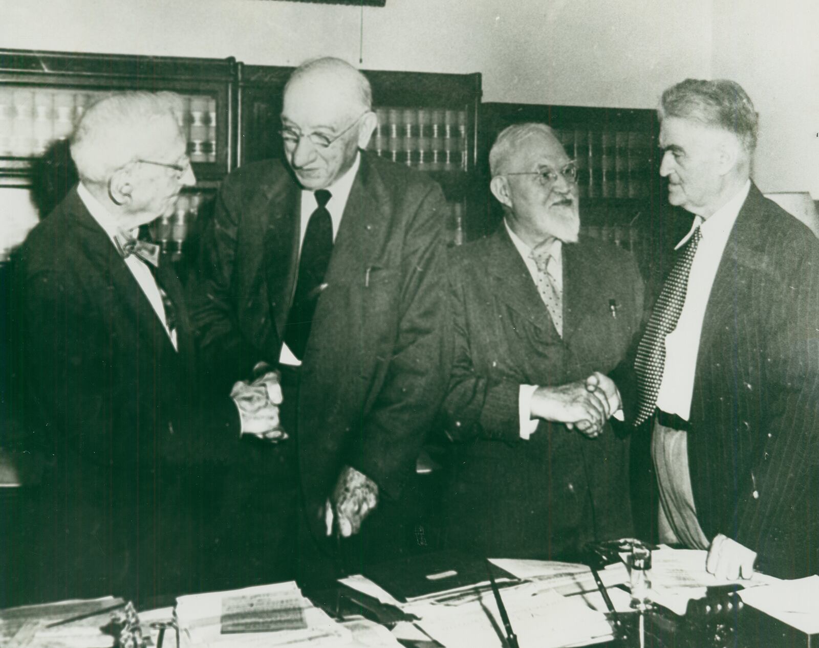 This 1950 photo shows three men on the right who were instrumental in things of local and national importance in history. The man on the far left is unidentified, shaking hands with former teacher and superintendent A.B. Graham, the founder of 4-H, which started an agriculturally based movement which today still offers opportunities to educate, advance, and engage youth. Next to him is George Harrison Shull, a local school teacher and scientist who pioneered developments with hybrid corn. Shull is shaking hands with Orton Rust, historian, author, newspaperman, and president of the Clark County Historical Society who organized ceremonies to recognize Graham and Shull’s work. On Wednesday, September 29, the Heritage Center will share stories about people, tools, machines, and companies that were important to Clark County’s agricultural history. Registration is required and can be found here: https://cutt.ly/farmhistory. PHOTO COURTESY OF THE CLARK COUNTY HISTORICAL SOCIETY