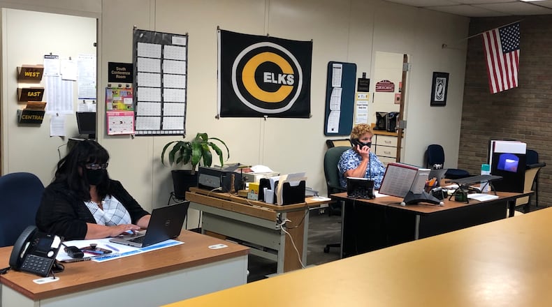 School office staff in Centerville High School's south unit answer calls earlier this fall. Centerville City Schools reported four new COVID-19 cases to the state dashboard Oct. 12-18. Some cases don't show up in the reporting if students or staff are working fully remote.