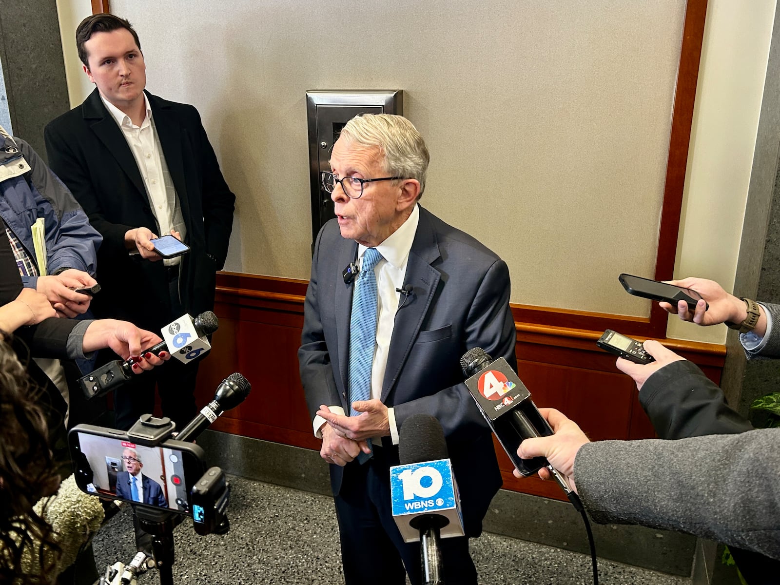 Ohio's Republican Gov. Mike DeWine briefs the press on Jan. 30, 2026, a few days before many of Springfield's Haitian immigrants are set to lose their legal protected status under federal law. AVERY KREEMER