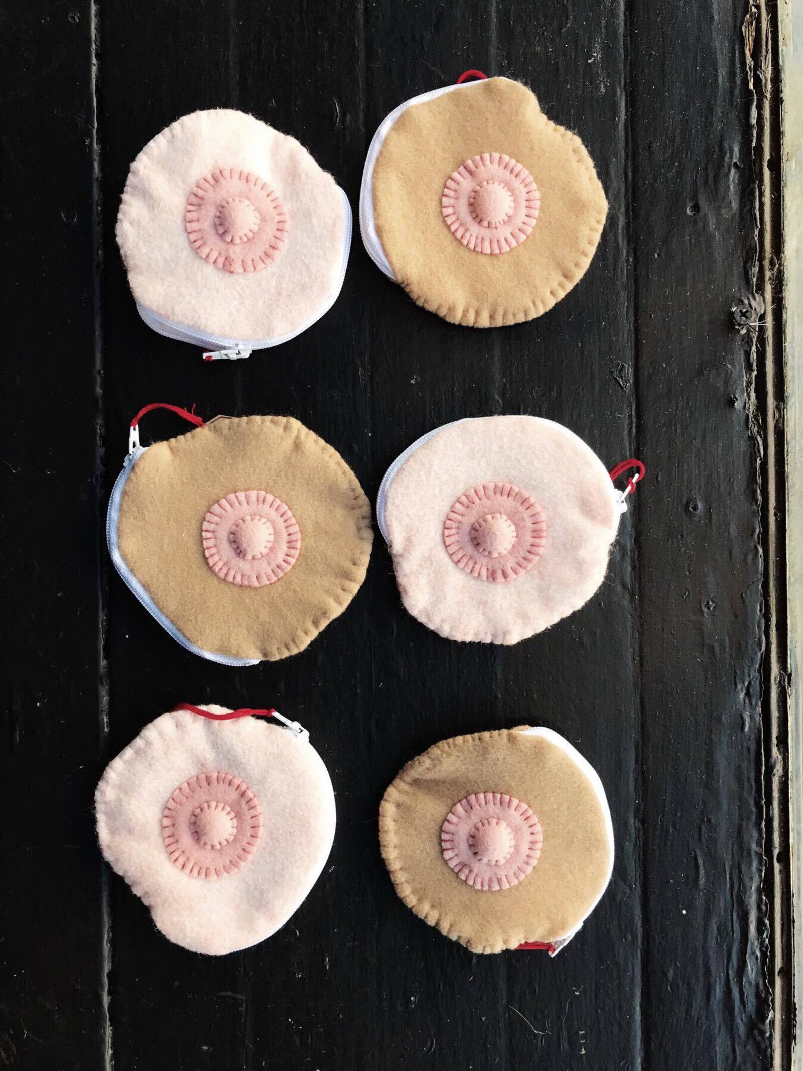 Heart Mercantile in Dayton's Oregon District  sells a variety of  "girl power" items with a twist. Items include vagina ornaments from Jacquelyn Marcella and Rebecca Mare Gonzalez.  The women also make breast ornaments.