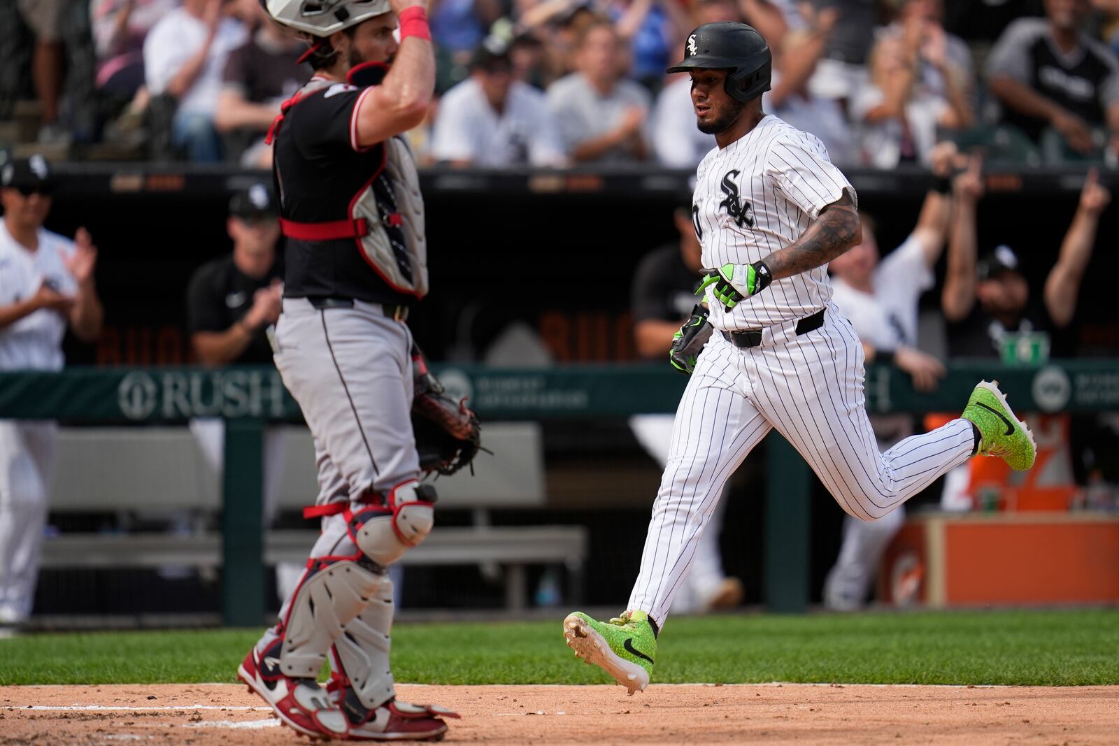 Chicago White Sox's Lenyn Sosa (50) scores on a single from Kyle Teel (8) during the fourth inning of a baseball game against the Cleveland Guardians, Saturday, July 12, 2025, in Chicago. (AP Photo/Erin Hooley)