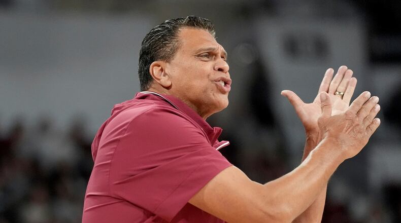 Bethune-Cookman head coach Reggie Theus urges his players on during the first half of an NCAA college basketball game against Mississippi State, Monday, Dec. 30, 2024, in Starkville, Miss. Mississippi State won 87-73. (AP Photo/Rogelio V. Solis)