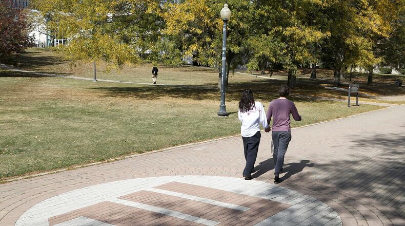 Students walk across campus at Wittenberg University. Bill Lackey/Staff