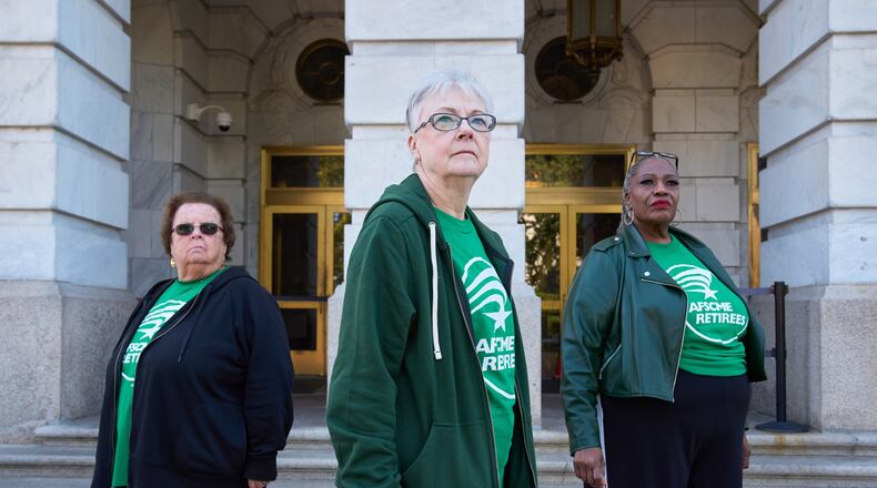 Jeanne Weaver, 79, of Ebensburg, Pa., left, Sue Conard, 75, of Wisc., and Vanessa Fields, 70, of Philadelphia, pose for a portrait on Capitol Hill, Thursday, Oct. 9, 2025, in Washington. (AP Photo/Jacquelyn Martin)