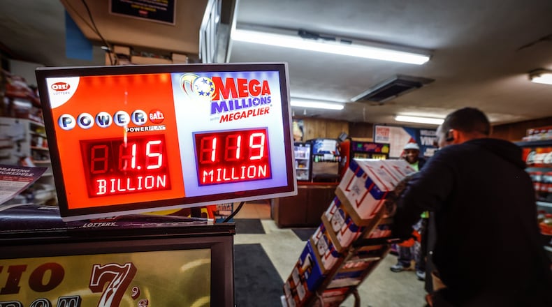 The lottery business was brisk at Vinny's Bar and Grill on Dryden Road in Moraine Friday November 4, 2022. The Powerball lottery has reached a whopping $1.6 billion. JIM NOELKER/STAFF