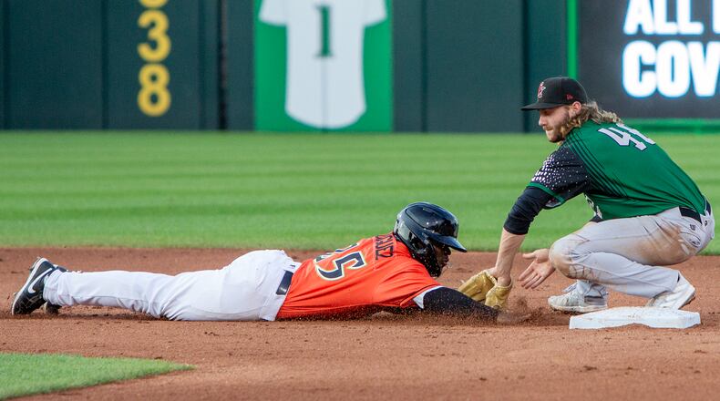 Dayton's Hector Rodriguez dives safely back into second base on a pick-off attempt as Great Lakes shortstop Noah Miller applies the tag Friday night at Day Air Ballpark. Jeff Gilbert/CONTRIBUTED