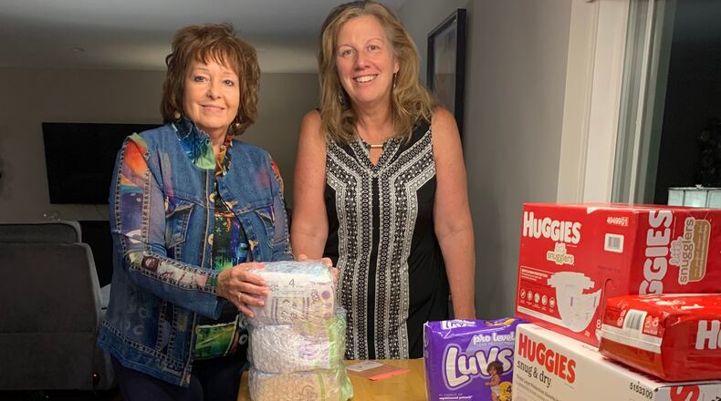 Maggie Schneemann, right, with Dayton Diaper Depot board member Doris Bonomini