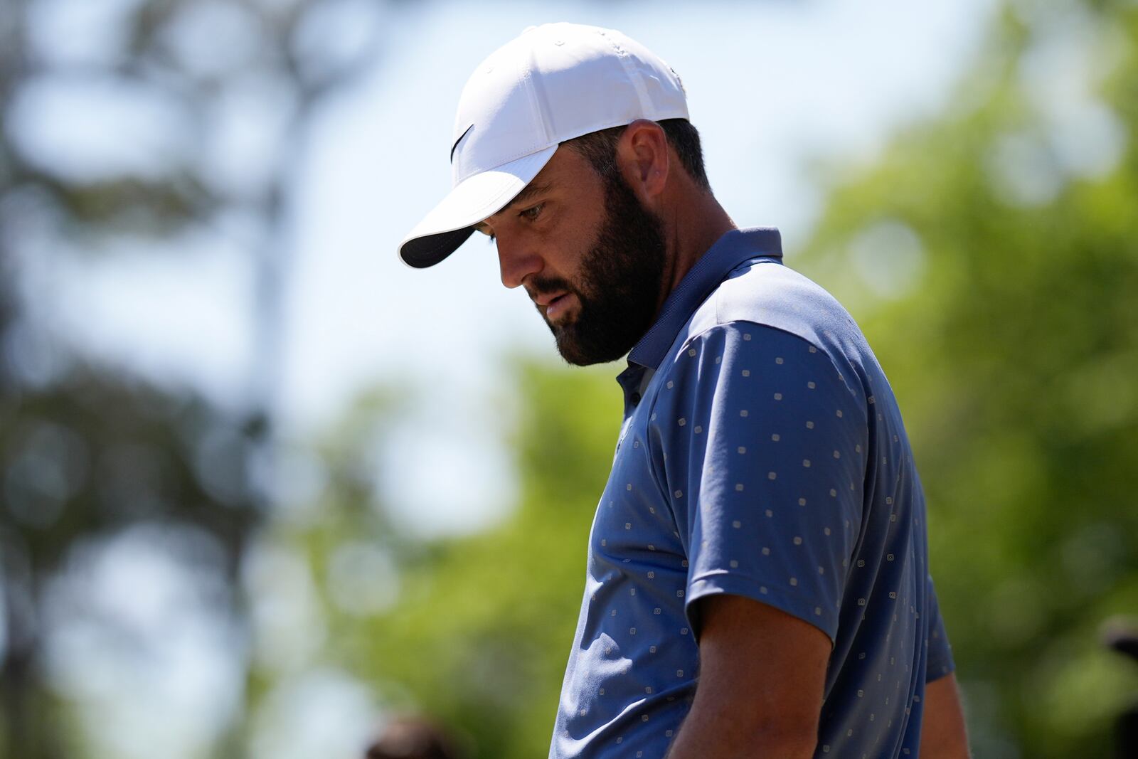 Scottie Scheffler prepares to hit from the seventh tee during the third round of the RBC Heritage golf tournament, Saturday, April 19, 2025, in Hilton Head Island, S.C. (AP Photo/Mike Stewart)