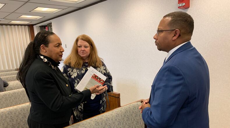 Shirley Stallworth, left, and Polly Parks, members of Takoda’s Call , speak with Montgomery County Administrator Michael Colbert following Tuesday’s county commission meeting. CHRIS STEWART / STAFF