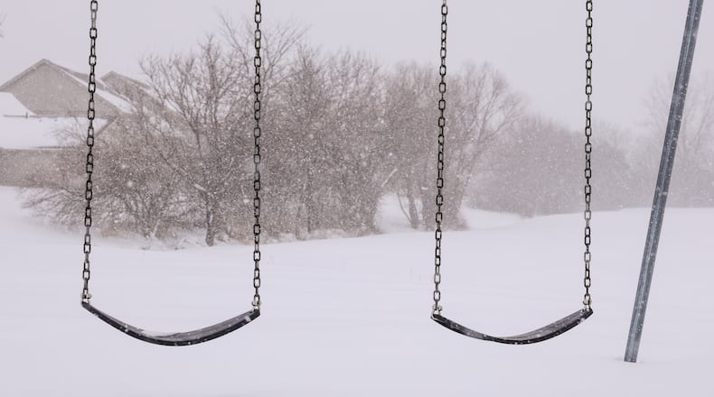 About eight inches of snow had fallen in Meadowpoint Park in Troy as of 1 p.m. BRYANT BILLING / STAFF