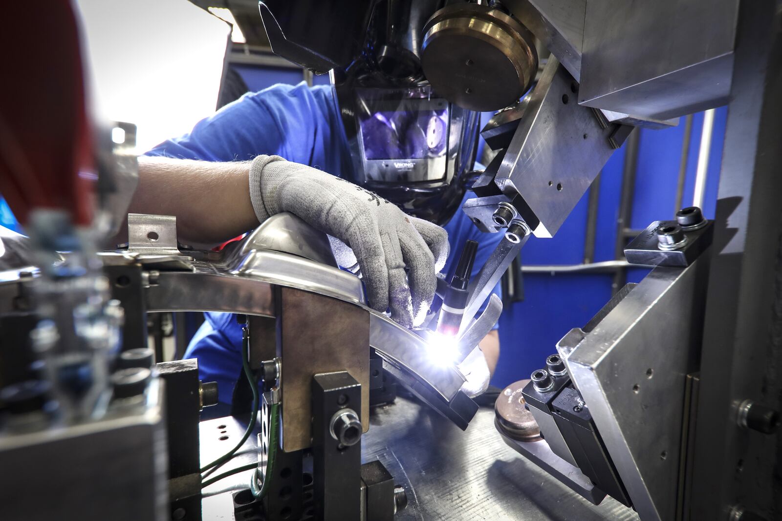 A GE Aerospace employee welds an aircraft engine component. A ribbon-cutting ceremony was held last May for a new Beavercreek facility, part of GE Aerospace’s $53.7 million investment in the past two years. CONTRIBUTED