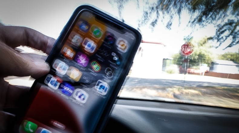 The distracted driving warning period ends today Oct. 4, 2023. Starting Thursday, Oct. 5, 2023, Ohio law enforcement officers can issue tickets for distracted driving such as talking or texting on a cell phone as a primary offense. PHOTO ILLUSTRATION/ JIM NOELKER/STAFF