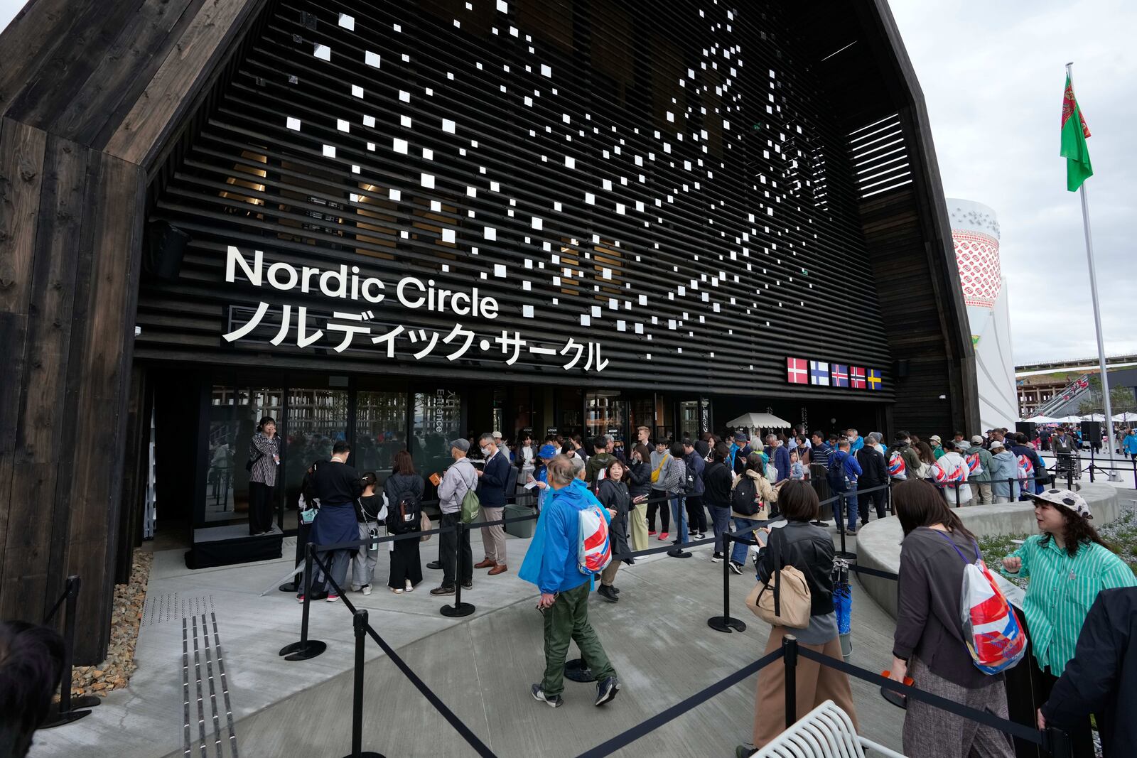 Visitor queue to enter the Nordic Circle pavilion on the opening day of Osaka Expo 2025 in Osaka, western Japan, Sunday, April 13, 2025. (AP Photo/Hiro Komae)