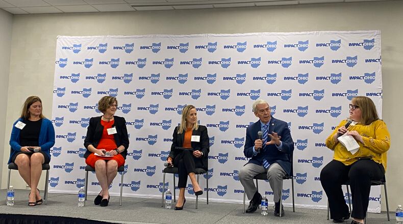 Panelists Shannon Cox, left, superintendent of the Montgomery County Educational Service Center, Kathleen Cleary, interim provost and senior vice president for Sinclair Community College, Kristi Clouse, senior managing director of talent for JobsOhio, and Randy Gardner, chancellor, the Ohio Department of Higher Education, at the Impact Ohio conference on Friday, discussing workforce talent. The moderator at right is Stephanie Keinath, vice president for strategic initiatives at the Dayton Area Chamber of Commerce. Eileen McClory / staff