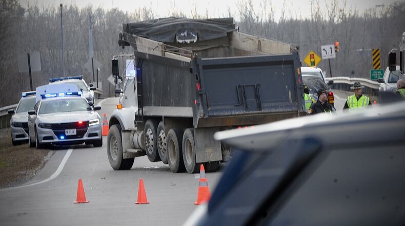 A teen girl was killed and two more teens were injured in a crash involving a car and dump truck at the intersection of Treibein and Dayton-Xenia roads in Beavercreek Twp. MARSHALL GORBY / STAFF