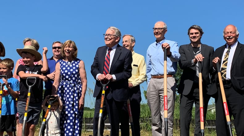 State officials, including Gov. Mike Dewine, and members of DeWine's family broke ground Monday on a new state park dedicated to Ohio's indigenous peoples. LONDON BISHOP/STAFF