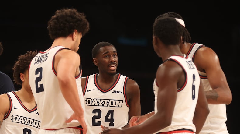 Dayton's Kobe Elvis talks to teammates during a game against Duquesne in the Atlantic 10 Conference tournament quarterfinals on Thursday, March 14, 2024, at the Barclays Center in Brooklyn, N.Y. David Jablonski/Staff