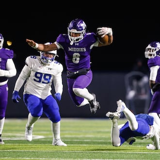 Middletown quarterback Joseph Ward carries the ball during their Division I State semifinal football game against St. Xavier Friday, Nov. 28, 2025 at Welcome Stadium in Dayton. NICK GRAHAM/STAFF