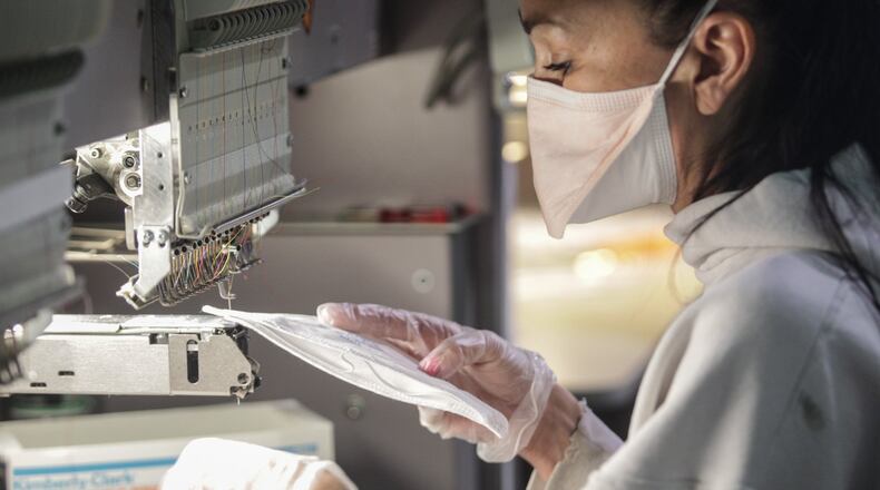 Epluno LLC in Miamisburg retooled some equipment and is now fixing masks to help in the coronavirus fight. JIM NOELKER/STAFF