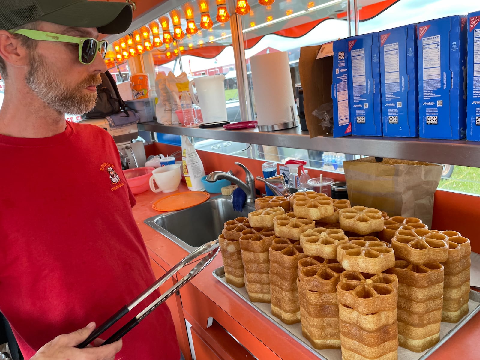 Pennsylvania Dutch by Rismiller Concessions serves funnel cakes, elephant ears, sugar waffles and deep fried Oreos. Pictured is Supervisor David Denney. NATALIE JONES/STAFF